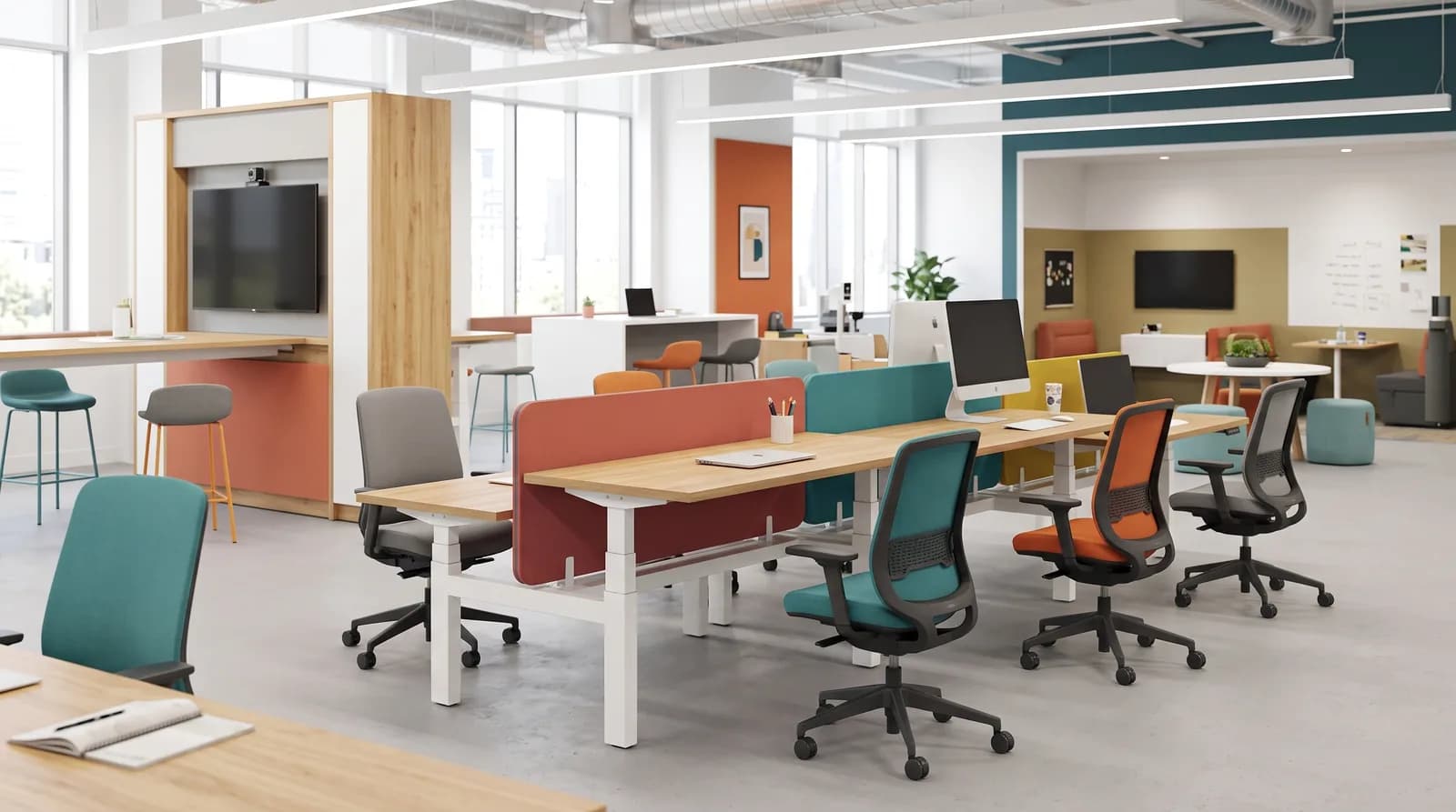 An agile workspace with height-adjustable bench desks divided by orange and teal acoustic screens, mesh task chairs on castors, and lounge booths and cafe-height tables in the zones beyond.